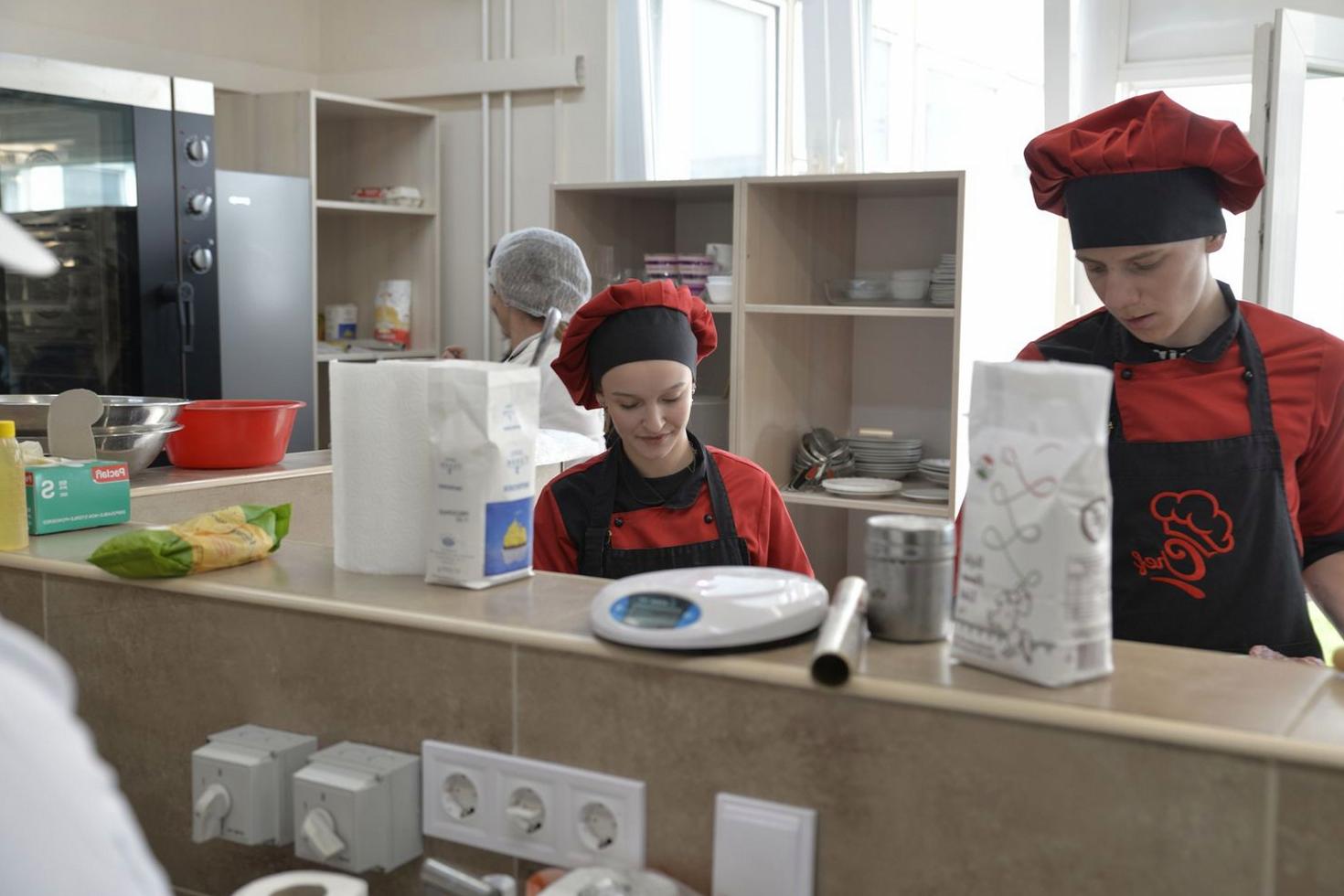 Culinary students in a professional kitchen